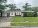 Charming single-story home featuring a well-maintained lawn and an attached one car garage with a concrete driveway at 7929 Roy Rd, Indianapolis, IN 46219