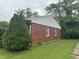 Side view of a brick home with a well-maintained lawn at 7929 Roy Rd, Indianapolis, IN 46219