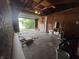 View of an empty garage with an open garage door and concrete floor at 7929 Roy Rd, Indianapolis, IN 46219