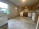 Functional kitchen featuring wood cabinets, appliances, and tile flooring at 7929 Roy Rd, Indianapolis, IN 46219
