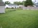 Large backyard showcasing a spacious lawn, perfect for outdoor activities at 80 Brentwood Dr, Mooresville, IN 46158