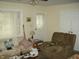 Cozy living room featuring a comfortable couch and chair at 80 Brentwood Dr, Mooresville, IN 46158
