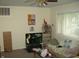 Comfortable living room with natural light, ceiling fan and entertainment setup at 80 Brentwood Dr, Mooresville, IN 46158