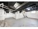 Spacious unfinished basement with exposed beams, mechanicals, and concrete floors at 805 N Euclid Ave, Indianapolis, IN 46201