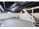 Spacious unfinished basement with exposed beams, mechanicals, and concrete floors at 805 N Euclid Ave, Indianapolis, IN 46201