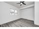Bedroom with hard surface flooring, ceiling fan, and white walls for a clean, modern aesthetic at 805 N Euclid Ave, Indianapolis, IN 46201