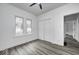 Bedroom featuring two windows, closet, and hard surface flooring for a modern touch at 805 N Euclid Ave, Indianapolis, IN 46201