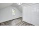 Bright bedroom with modern floors, neutral walls, and large closet at 805 N Euclid Ave, Indianapolis, IN 46201
