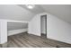 Bright bedroom featuring modern floors, neutral walls, and unique ceiling at 805 N Euclid Ave, Indianapolis, IN 46201