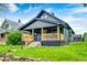 Charming home with a covered front porch and well-maintained lawn at 805 N Euclid Ave, Indianapolis, IN 46201