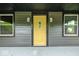 Inviting front entrance with a yellow door, exterior lights, and the house number 805 at 805 N Euclid Ave, Indianapolis, IN 46201