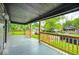 Open-air front porch offering a glimpse of the neighborhood street and surrounding homes at 805 N Euclid Ave, Indianapolis, IN 46201