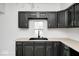 New kitchen featuring sleek black cabinetry, butcher block countertops, and stainless steel hardware at 805 N Euclid Ave, Indianapolis, IN 46201