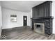 Cozy living room with new flooring and black stone fireplace at 805 N Euclid Ave, Indianapolis, IN 46201