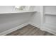 Finished attic space featuring hardwood floors, a built-in shelf, and natural light at 815 E 24Th E St, Indianapolis, IN 46205