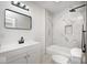 Modern bathroom with marble tile, a vanity and a shower with a niche at 815 E 24Th E St, Indianapolis, IN 46205