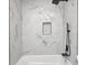 Bathroom with tile shower, black fixtures, and niche at 815 E 24Th E St, Indianapolis, IN 46205
