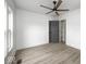 Bedroom with hardwood floors, a ceiling fan, and a gray closet door at 815 E 24Th E St, Indianapolis, IN 46205