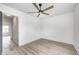 This bedroom features light wood flooring and a modern ceiling fan at 815 E 24Th E St, Indianapolis, IN 46205
