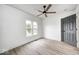 Bedroom with hardwood floors, a ceiling fan, and natural light coming through the windows at 815 E 24Th E St, Indianapolis, IN 46205