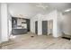 Bright and airy living room featuring modern lighting, a stylish kitchen, and wood floors at 815 E 24Th E St, Indianapolis, IN 46205
