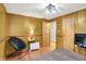 Bedroom with hardwood floors, TV, and small side table at 8272 Calgary Ct, Indianapolis, IN 46268
