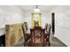Formal dining room with hardwood floors, an elegant chandelier, and a wooden table at 8272 Calgary Ct, Indianapolis, IN 46268