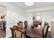Open-concept dining space that flows into the kitchen, with hardwood floors and modern lighting at 8272 Calgary Ct, Indianapolis, IN 46268