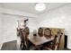 Spacious dining area featuring a wooden dining table set and hardwood flooring at 8272 Calgary Ct, Indianapolis, IN 46268