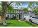 Charming two-story home with gray siding, white trim, and a well-manicured front lawn at 8272 Calgary Ct, Indianapolis, IN 46268