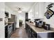 Galley style kitchen with stainless steel appliances and dark hardwood floors at 8272 Calgary Ct, Indianapolis, IN 46268