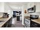 Kitchen featuring stainless steel microwave and stove at 8272 Calgary Ct, Indianapolis, IN 46268