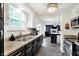Spacious kitchen with stainless steel appliances and a view into the living room at 8272 Calgary Ct, Indianapolis, IN 46268