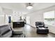 Open-concept living room with hardwood floors, modern lighting, and a view into the kitchen at 8272 Calgary Ct, Indianapolis, IN 46268