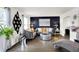 Elegant living room showcasing a dark accent wall, modern decor, and stylish gray furniture at 8272 Calgary Ct, Indianapolis, IN 46268