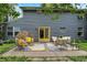 Inviting backyard patio with outdoor seating, decorative rugs, and yellow accents at 8272 Calgary Ct, Indianapolis, IN 46268