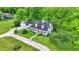 Aerial view of a charming two-story home with a well-manicured front yard at 8301 E County Road 801 S, Plainfield, IN 46168