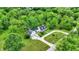 Aerial view of home with pool, lush green yard and driveway at 8301 E County Road 801 S, Plainfield, IN 46168