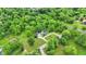 Aerial view of home with lush mature trees surrounding at 8301 E County Road 801 S, Plainfield, IN 46168