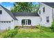 Charming white home with a spacious backyard and a screened in porch area at 8301 E County Road 801 S, Plainfield, IN 46168