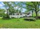 Large backyard featuring mature trees and a trampoline at 8301 E County Road 801 S, Plainfield, IN 46168