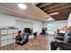 Spacious basement with a fireplace, wood-look flooring, and plenty of room for activities at 8301 E County Road 801 S, Plainfield, IN 46168