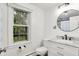 Bathroom featuring a marble countertop, vanity, and a window overlooking a yard at 8301 E County Road 801 S, Plainfield, IN 46168