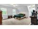 Bright bedroom featuring a neutral color palette, two windows, and carpeted floors at 8301 E County Road 801 S, Plainfield, IN 46168