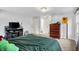 Bright bedroom featuring a neutral color palette, three windows, and carpeted floors at 8301 E County Road 801 S, Plainfield, IN 46168