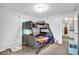 Bedroom with bunk beds featuring a neutral color palette, with natural light and carpeted floors at 8301 E County Road 801 S, Plainfield, IN 46168