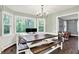 Bright dining room with large windows, chandelier, and long wooden table at 8301 E County Road 801 S, Plainfield, IN 46168