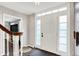 Welcoming entryway with white door, sidelights, and elegant chandelier at 8301 E County Road 801 S, Plainfield, IN 46168