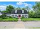 Beautiful white home with black shutters and a vibrant red front door at 8301 E County Road 801 S, Plainfield, IN 46168