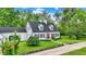 Classic home showcasing a red front door and dormer windows at 8301 E County Road 801 S, Plainfield, IN 46168